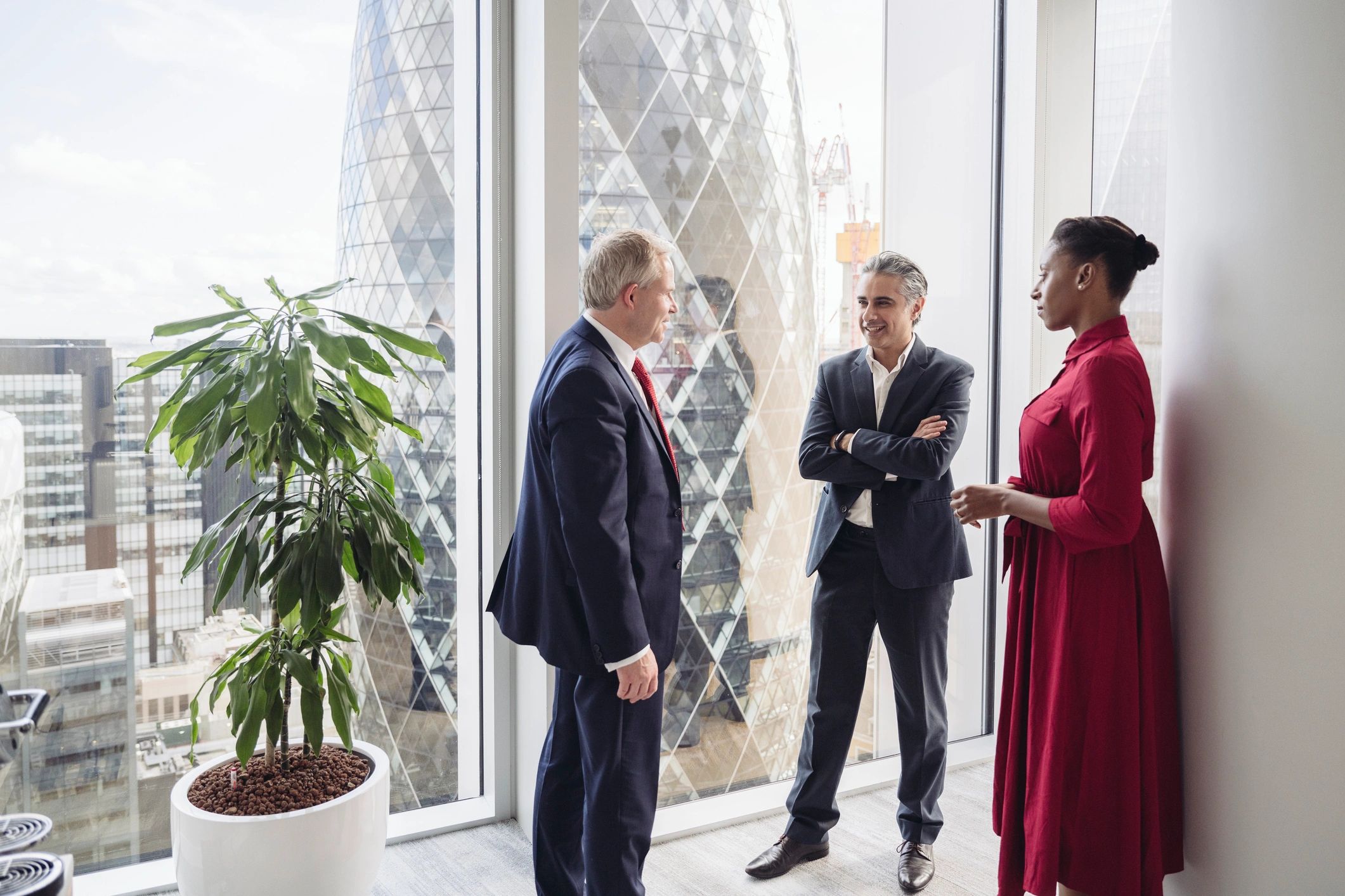 Business professionals in a modern office discussing work