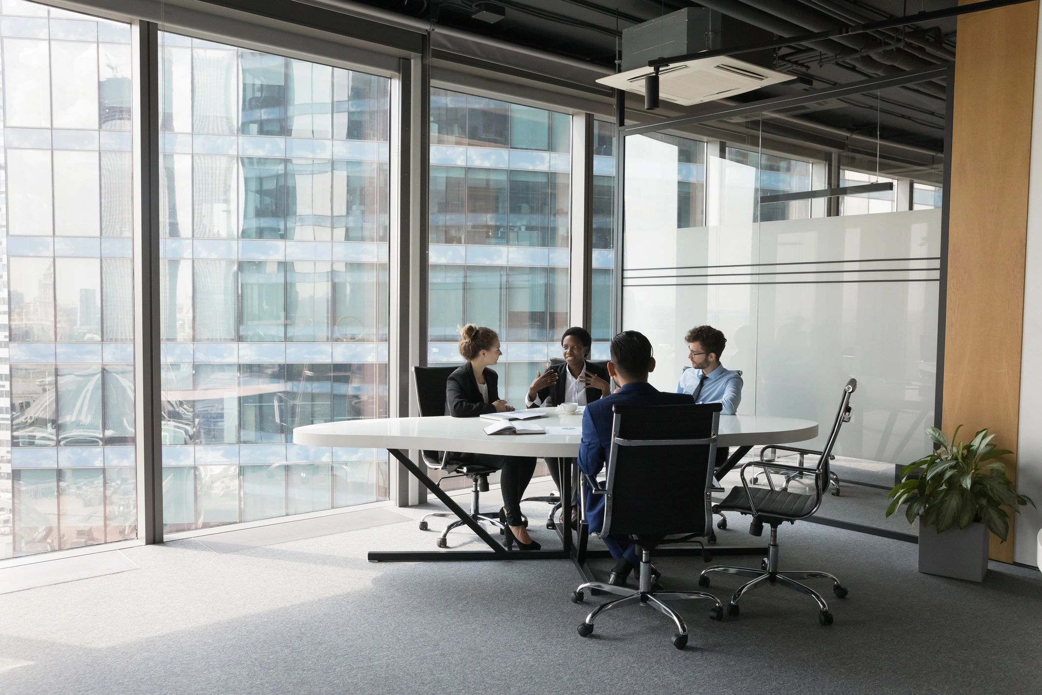 Business team discussing plans in a meeting room