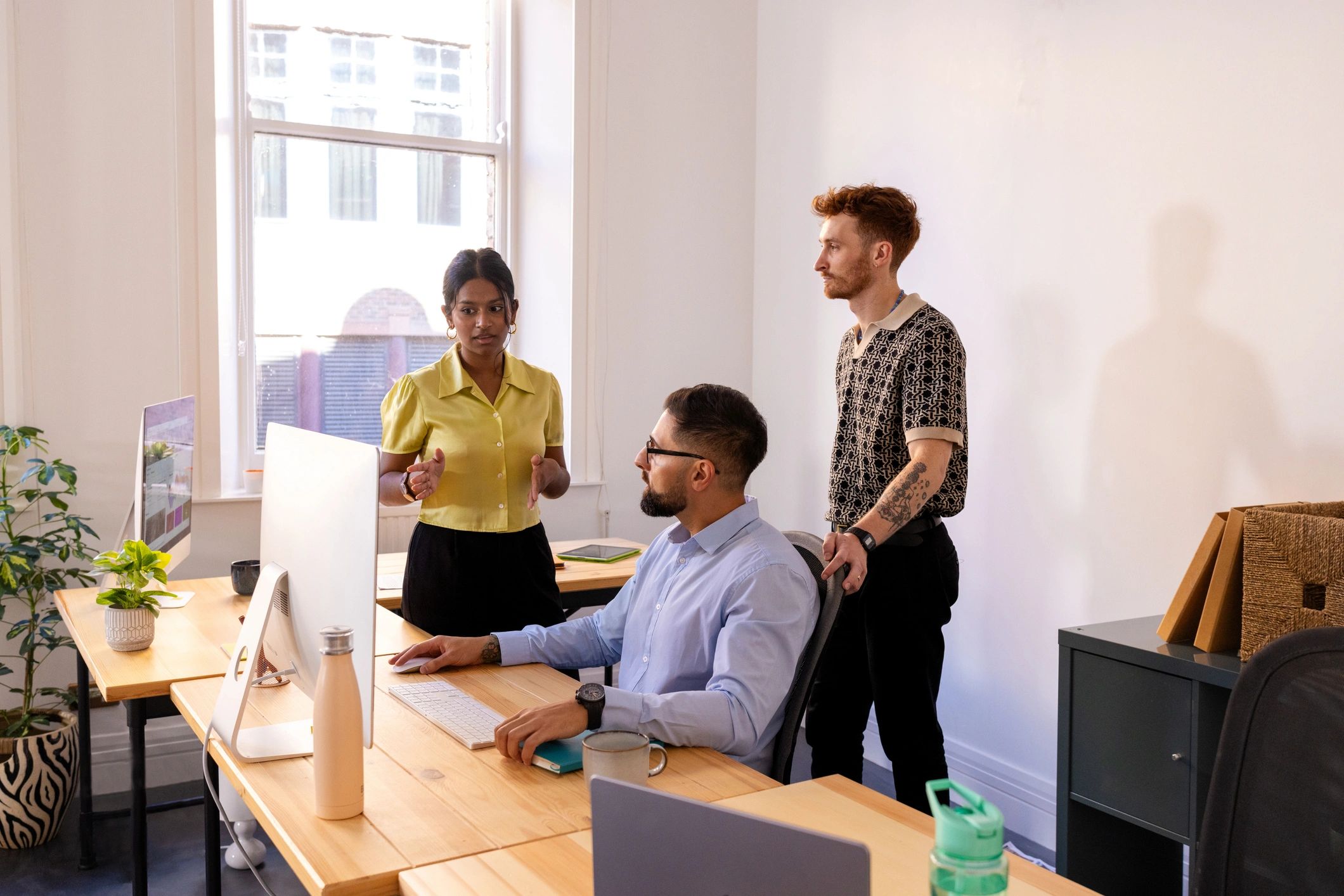 Professional colleagues discussing work in an office