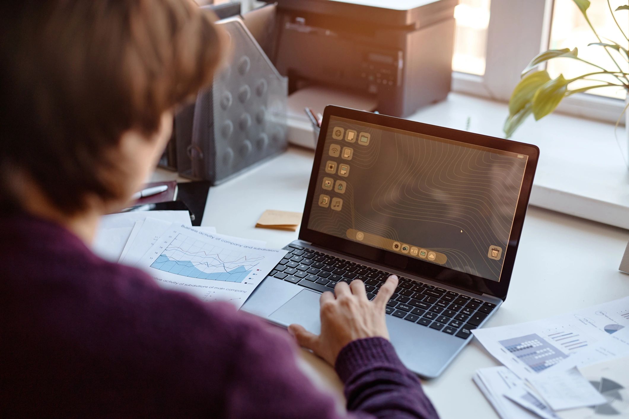 Professional reviewing payroll data on a laptop