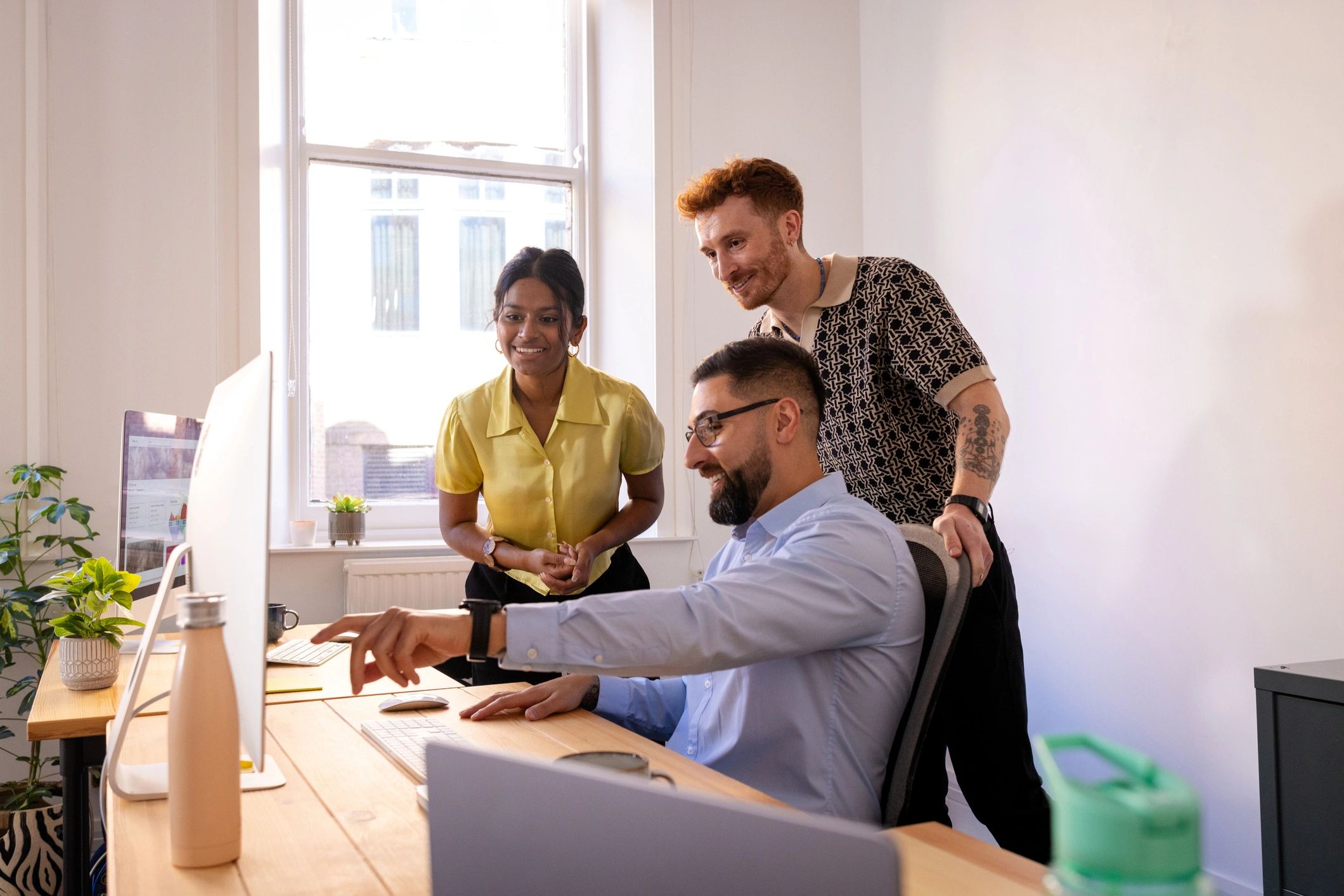 Colleagues reviewing strategy in a modern office